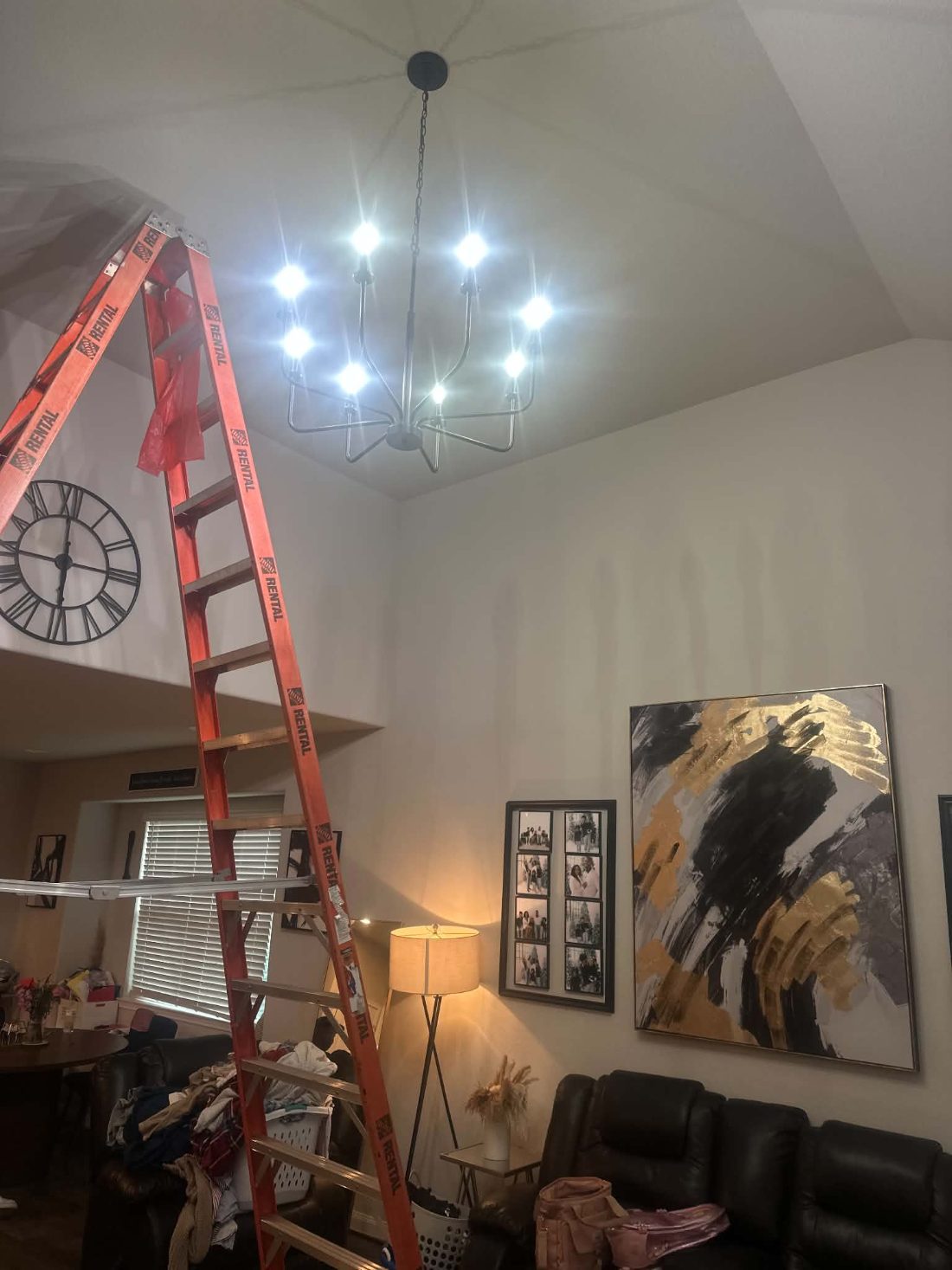 Chandelier installed on a vaulted living room ceiling